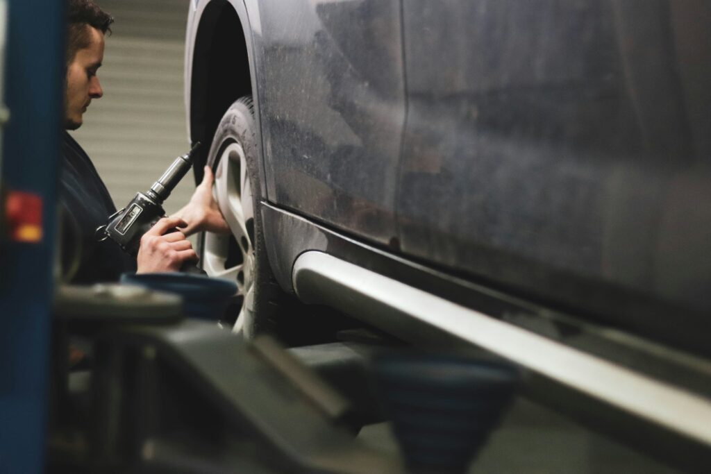 bolting a wheel on a car